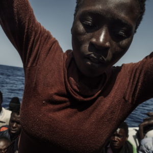 Mediterranean Sea, Italy. A young woman is rescued on an Italian Coast Guard Series 300 cutter.